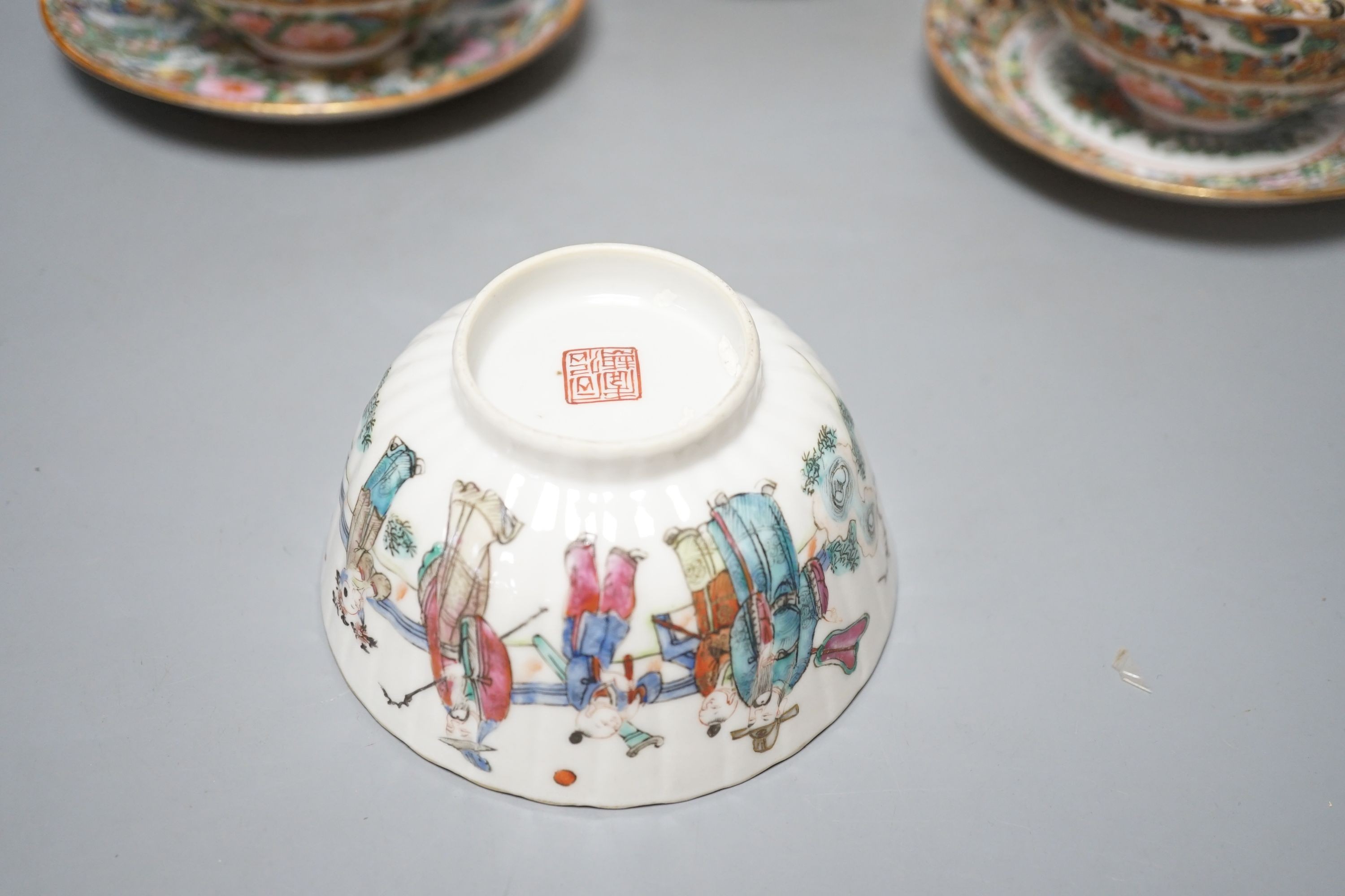 A Chinese porcelain tea bowl and stand and a pair of Cantonese bowls, covers and stands, 14cm diameter